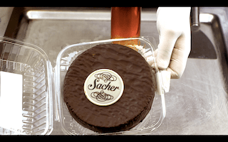 Sacher Torte, chocolatey traditional treat for special moments with apricot jam and chocolate icing
